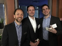 People in business attire smiling at camera