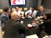 Group of people at poker table