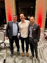 Three people smiling at camera