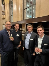 Four people smiling at camera