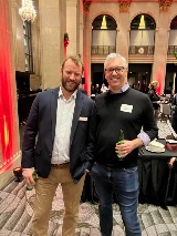 two people smiling at camera