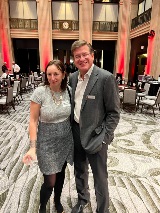 two people smiling at camera