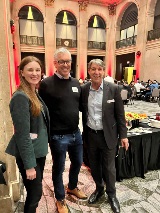 Three people smiling at camera