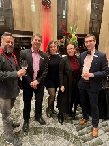 Five people smiling at camera