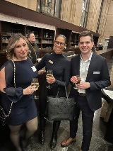 Three people smiling at camera