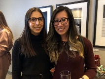 two women smiling at camera