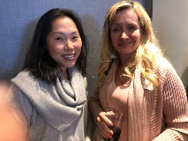 Two women smiling at camera