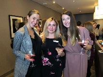 Three women smiling at camera