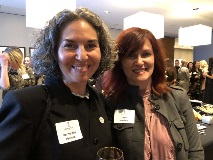 Two women smiling at camera
