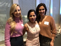 Three women smiling at camera