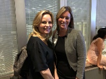 two women smiling at camera