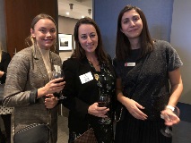 three women smiling at camera