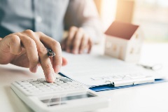 Real estate agent crunching numbers