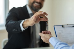 Real estate lawyer handing over keys