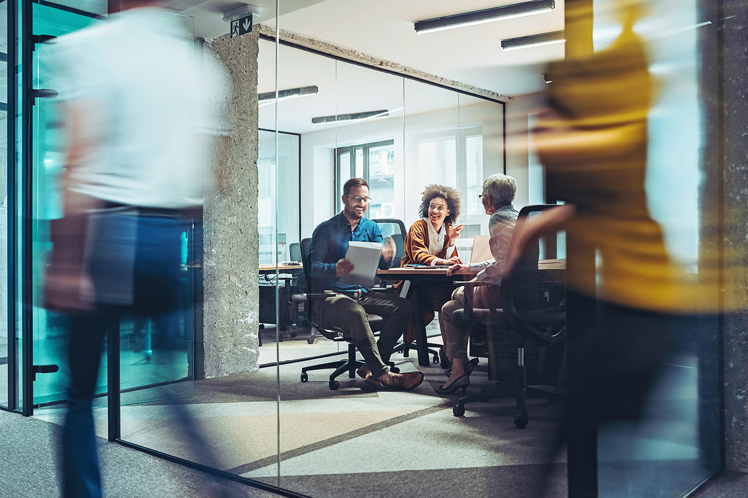 Business professionals in modern board room