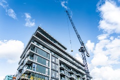 Crane working on the top floor of a building