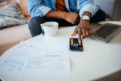 Accountant doing work with coffee on a coffee table