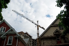 Construction crane over houses