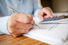 Accountant using a calculator