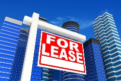 For lease sign beside a commercial real estate