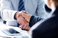 Two lawyers shaking hands