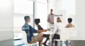 Blurry image of business people in boardroom