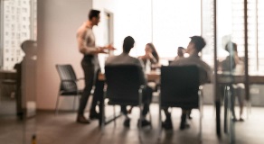 business professionals in modern boardroom