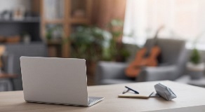 Laptop on desk in modern apartment