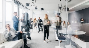 People conversing in corporate lounge