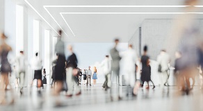 People walking inside corporate building