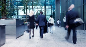 People walking outside corporate building